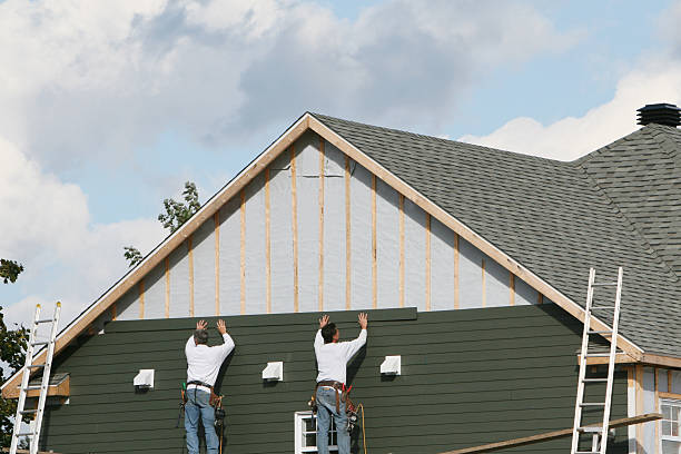 Professional Storm Damage Siding Repair technician working in Waverly, FL